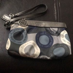 Gray, blue, and white Coach wristlet.